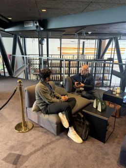 talking with a customer in the VIP lounge